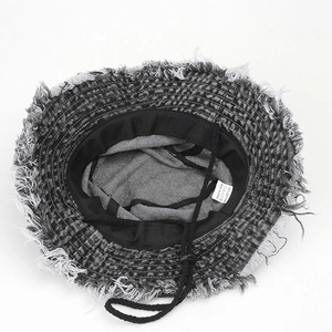 Retro washed denim bucket hat with frayed edges and adjustable drawstring chin strap