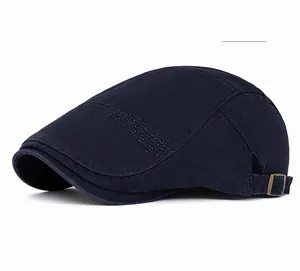 Detail of navy blue cotton ivy cap with adjustable metal buckle and decorative stitching