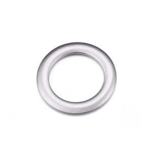 Macro detail of polished silver stainless steel ring pendant with smooth metallic finish