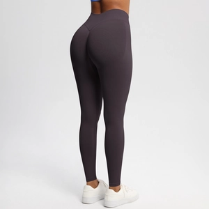 Detail of high waist seamless yoga leggings with scrunch butt lifting design in dark purple