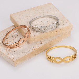 Three-piece infinity symbol bangles in gold, silver, and rose gold stainless steel