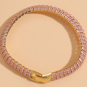 Detail of double-row pink zircon bracelet with 14K gold plating and secure safety clasp