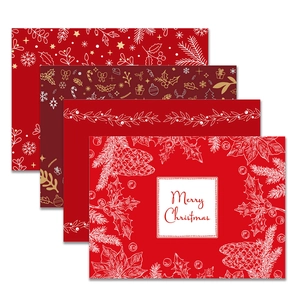 Set of four red Christmas table mats with linen texture and festive holiday prints