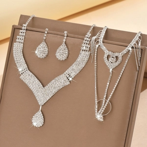 Luxury rhinestone bridal jewelry set with necklace earrings and bracelet on display
