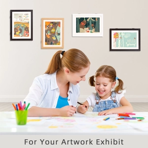 Art frame detail showing black, white, and wood finishes with kids' artwork display