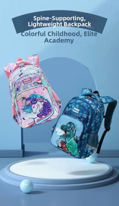 Detail view of unicorn and dinosaur themed school bags with thick handles and side mesh pockets