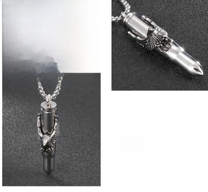 Macro detail of solid stainless steel bullet pendant with eagle relief and heavy chain