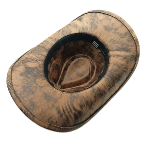 Detail of western cowboy hat interior showing sweatband and 100% polyester material label