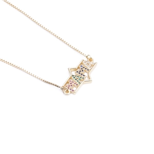 Macro shot of gold hexagon necklace with colorful MAMA gems and zircon star details
