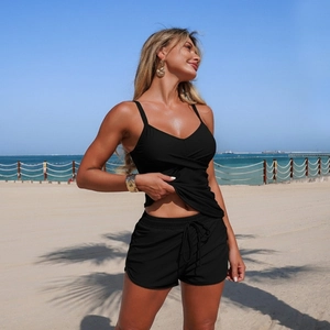 Close-up of black two-piece tankini set featuring a V-neck top and white drawstring shorts