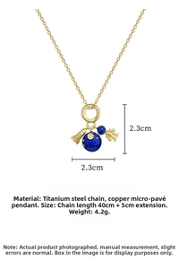 Detailed close-up of titanium steel space necklace with rocket, planet and astronaut charms
