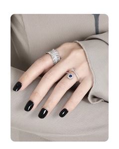 Detailed view of women's S925 silver cross ring featuring blue zircon inlay on hand