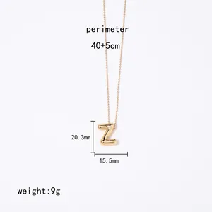Close-up of gold Z-shaped pendant necklace showing precise measurements and 9g weight