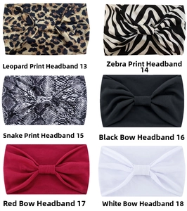 Detail view of wide yoga headbands in leopard, zebra print and solid color assortments