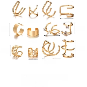 Minimalist gold alloy U-shaped ear cuffs and rings set with sparkling crystals