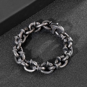 Detailed close-up of retro stainless steel nail bracelet with 316L material engraving