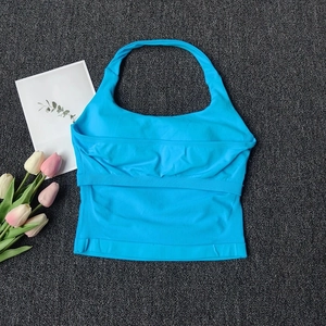 Inside view of seamless blue yoga vest showing built-in support and breast pad slots