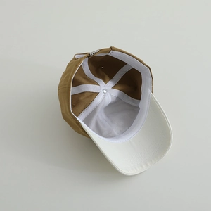 Detail view of children baseball cap with metal adjustable buckle and inner canvas lining