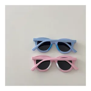 Detail view of pink and blue silicone kids polarized sunglasses with soft nose pads