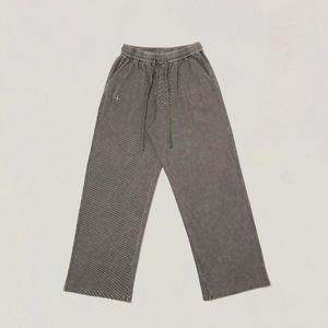 Detailed view of elastic waistband and drawstring on vintage washed grey wide-leg pants
