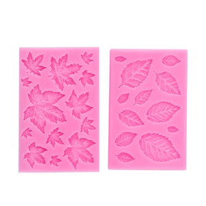 Pink silicone leaf molds set featuring detailed maple and foliage textures for cake decor