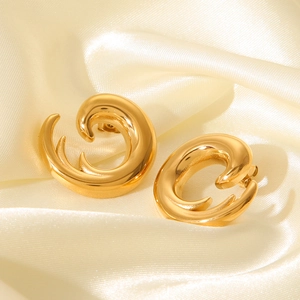 Minimalist gold stainless steel irregular spiral earrings on light gold silk backdrop
