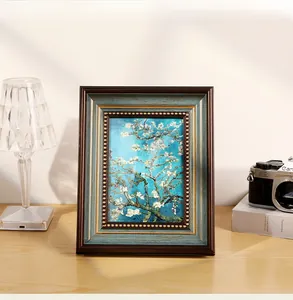 Close-up of vintage American style frame with aged wood texture and Van Gogh Almond Blossom