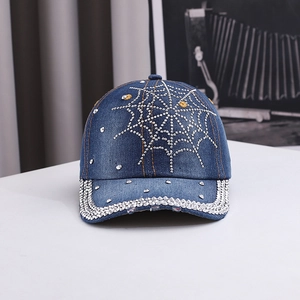 Navy blue denim baseball cap featuring rhinestone spider web design and metal rivets