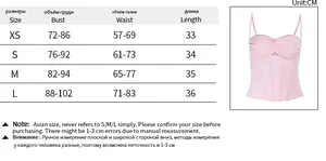 Detailed size chart for ribbed crop top with XS to L measurements and pink tank top image