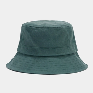 Close-up of dark green canvas bucket hat with reinforced stitching and twill texture