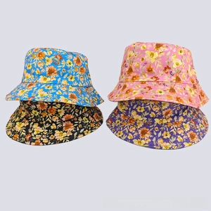 Detail view of colorful floral bucket hats with multi-row stitching on the brim