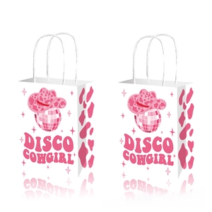Detailed view of two Disco Cowgirl gift bags with pink cow print and cowboy hat design