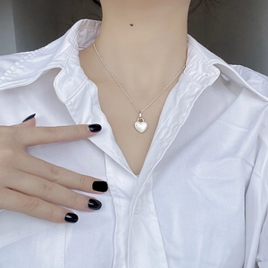 S925 sterling silver heart locket necklace with white mother of pearl on white shirt