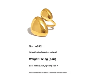Detailed view of chunky irregular golden stainless steel ring with 2.8cm wide teardrop design