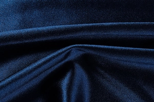 Detail of dark blue metallic fabric with elegant shimmer and fine micro-textures