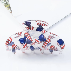 Floral print acrylic hair claw clip with American flag pattern on white background
