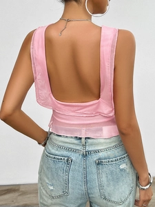 Back view of pink Y2K backless mesh camisole featuring delicate ruffled hem details