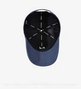 Detailed inner view of blue cotton baseball cap with mesh lining and adjustable strap
