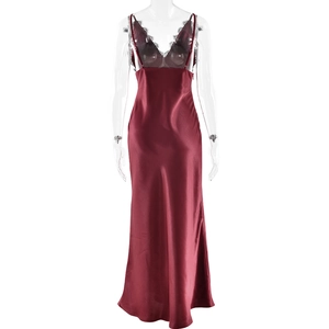 Detail view of wine red satin bodycon dress with black lace trim and slender straps