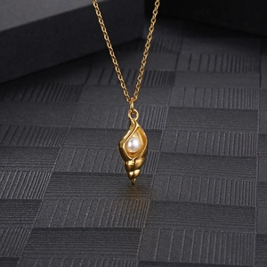 Minimalist golden conch pendant necklace with white pearl on a titanium steel cross chain
