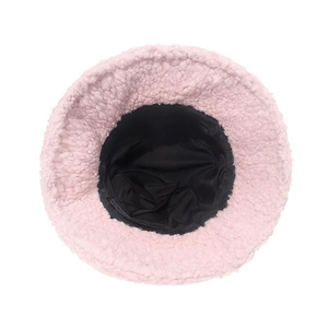 Detail of pink faux shearling bucket hat with soft texture and black inner lining