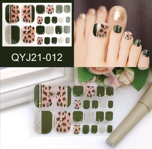 Deep green and leopard print toe nail stickers with gold accents and glitter finish