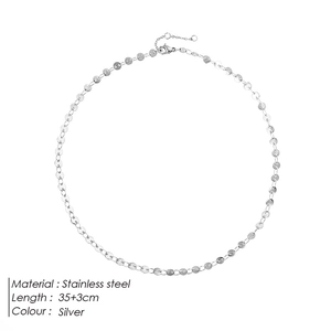 Minimalist silver stainless steel choker necklace featuring flat circular disc links