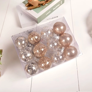 12-pack rose gold Christmas ball ornaments in box with glitter and foil designs