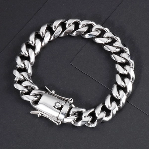 Detailed view of silver stainless steel Cuban link bracelet with wide push-lock clasp