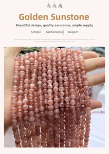 Macro view of semi-translucent orange-pink sunstone round beads for jewelry making
