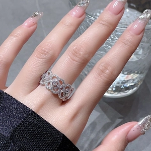 Detail of hollow lace silver ring with micro-pave cubic zirconia on hand