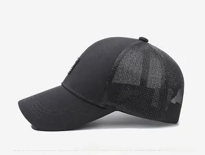 Side view detail of a black mesh trucker cap with breathable polyester fabric panels