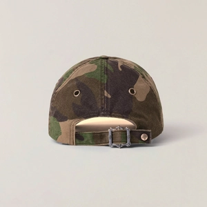 Detail view of camouflage baseball cap back with adjustable metal buckle and cross rivet