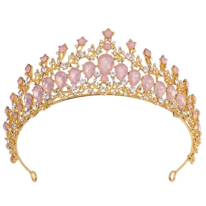 Detail of champagne gold tiara with pink teardrop crystals and white rhinestones